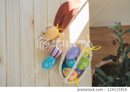 easter holiday concept with colorful egg and put in basket and put on wood table easter holiday concept with colorful egg and put in basket and put on wood table 124115919