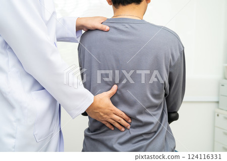 Physical therapy, Asian therapist doctor treat perform pain young man in hospital. 124116331
