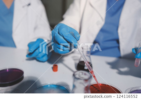 Researchers working in the clinical laboratory Researchers working in the clinical laboratory 124116552