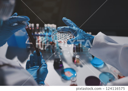 Researchers working in the clinical laboratory Researchers working in the clinical laboratory 124116575