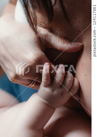 Tender Moment Between Mother and Baby During Breastfeeding Tender Moment Between Mother and Baby During Breastfeeding 124117861