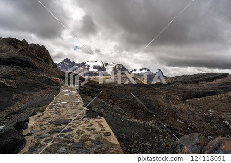 Stone trail leading to Pastoruri Glacier, Huaraz, Peru, amidst rugged mountains 124118091