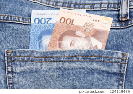 Moroccan dirham in the pocket of blue jeans 124119489