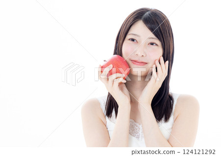 A woman eating an apple 124121292