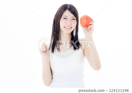 A woman eating an apple A woman eating an apple 124121296