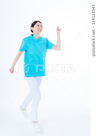 Jumping young woman nurse 124121343