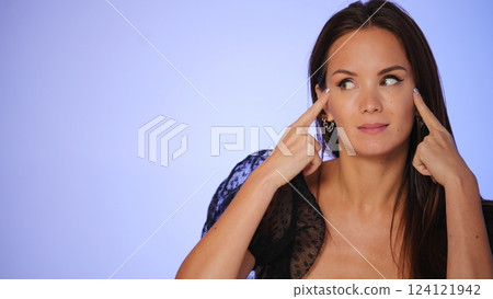 Woman practicing facial yoga for youthful skin Woman practicing facial yoga for youthful skin 124121942