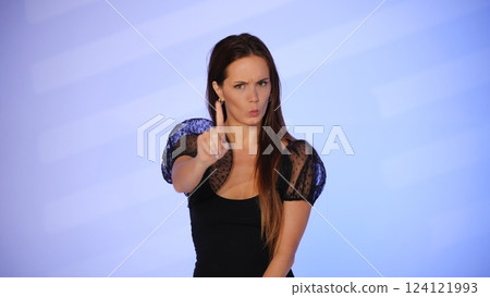 Beauty blogger making a strict warning gesture Beauty blogger making a strict warning gesture 124121993