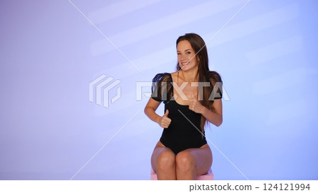 Beauty blogger smiling and giving thumbs up Beauty blogger smiling and giving thumbs up 124121994