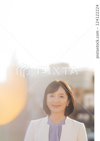 A middle-career woman taking a break on the roof A middle-career woman taking a break on the roof 124122224