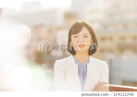 A middle-career woman taking a break on the roof A middle-career woman taking a break on the roof 124122246
