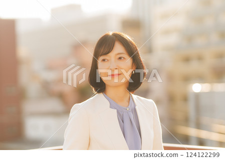 A middle-career woman taking a break on the roof A middle-career woman taking a break on the roof 124122299