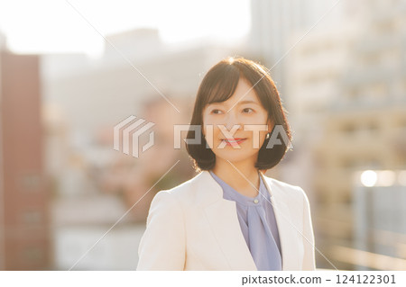 A middle-career woman taking a break on the roof A middle-career woman taking a break on the roof 124122301
