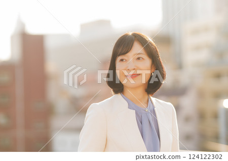 A middle-career woman taking a break on the roof A middle-career woman taking a break on the roof 124122302