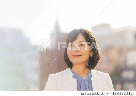 A middle-career woman taking a break on the roof 124122312