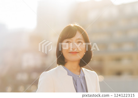 A middle-career woman taking a break on the roof A middle-career woman taking a break on the roof 124122315