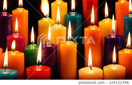 Close-up of bright multicolored burning candles in the dark Close-up of bright multicolored burning candles in the dark 124122396