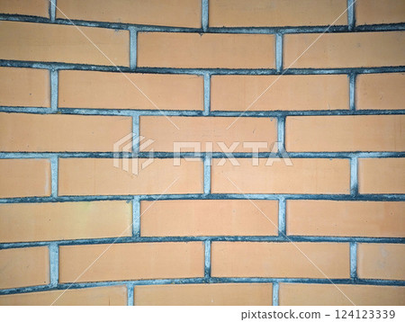 yellow facing brick wall, textured background yellow facing brick wall, textured background 124123339