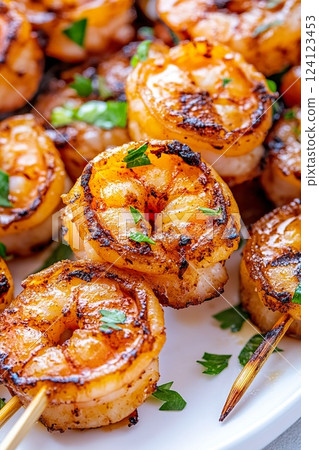 Delicious grilled shrimp skewers served with fresh herbs and spices. 124123453