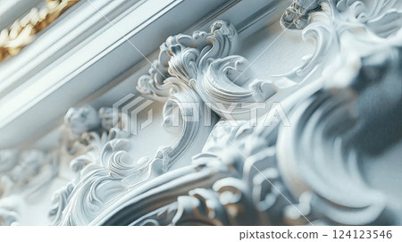 Elegant white baroque architectural detail with ornate scrollwork and plasterwork. Classical interior design element showcases intricate rococo style molding with soft lighting Elegant white baroque architectural detail with ornate scrollwork and plasterwork. Classical interior design element showcases intricate rococo style molding with soft lighting 124123546