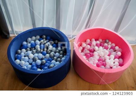 Two Soft Play Ball Pits Filled with Colored Plastic Balls for Childrens' Playroom or Indoor Activity Two Soft Play Ball Pits Filled with Colored Plastic Balls for Childrens' Playroom or Indoor Activity 124123903