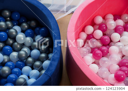 Colorful Indoor Ball Pit for Children Filled with Blue, Grey, White, Pink, and Transparent Play Balls 124123904