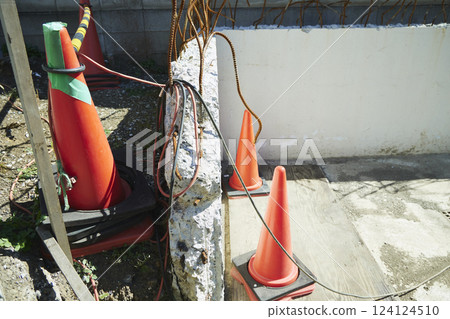 The rebar of a demolished exterior wall. It is rusted and bent in all directions. 124124510