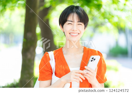 Woman with smartphone 124124572