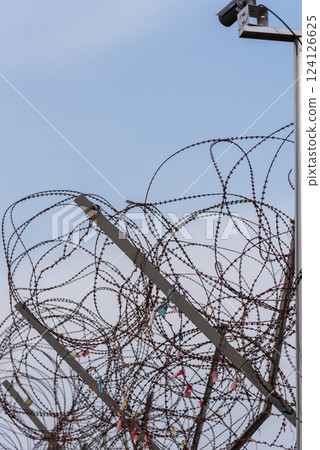 Barbwire at the DMZ Korean Demilitarized Zone that separates North and South Korea in Paju, South Korea Barbwire at the DMZ Korean Demilitarized Zone that separates North and South Korea in Paju, South Korea 124126625