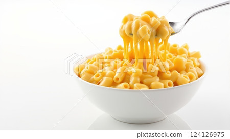 Creamy mac and cheese served in a bowl with a fork lifting a serving at a cozy dining setting 124126975