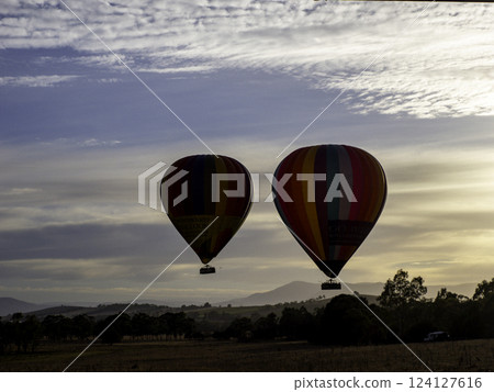 Balloon floating in the sunrise Balloon floating in the sunrise 124127616