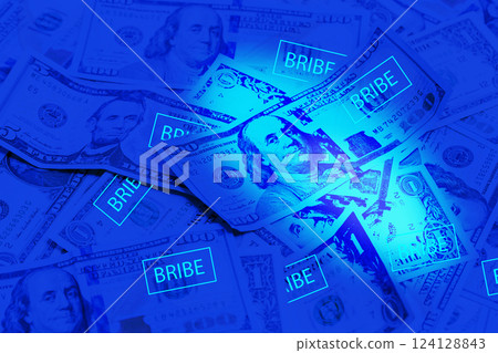 Bribe background. American Dollar in ultraviolet light 124128843