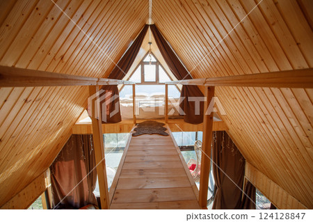 wooden comfortable chalet interior with sunlight. no body wooden comfortable chalet interior with sunlight. no body 124128847