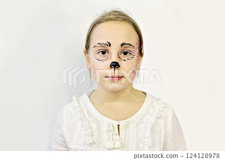 Toddler girl with creative carnival makeup on white bakground 124128978