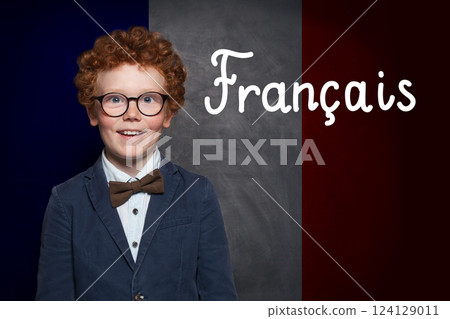 School child boy on French flag with the inscription Francais in French 124129011