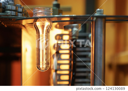 The drinking water bottle manufacturing process by blow mold machine. 124130089