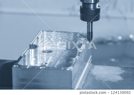The CNC milling machine chamfer cutting aluminum housing part by chamfer tool in the light blue scene. The CNC milling machine chamfer cutting aluminum housing part by chamfer tool in the light blue scene. 124130092