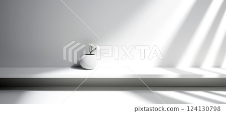 Minimalist interior with a white ceramic vase and delicate flowers placed on a sleek white shelf. The composition emphasizes simplicity, elegance, and modern interior design. 124130798