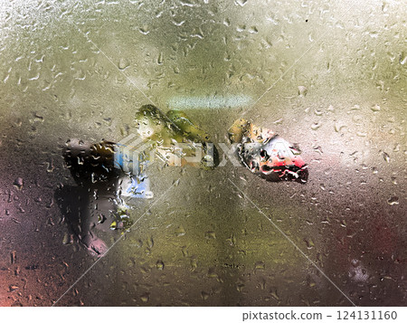 Wet window during rain. Window with raindrops. Wet surface. Background with copy space. 124131160