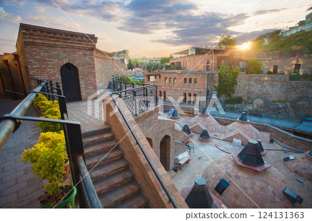 Spectacular landscape of historical Tbilisi with sulfur baths on the background of sunset sky Spectacular landscape of historical Tbilisi with sulfur baths on the background of sunset sky 124131363