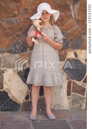 Happy child looking at camera outdoors Happy child looking at camera outdoors 124131502