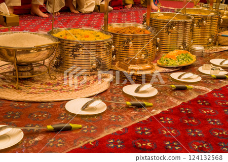 View of golden banquet table setting for for guests in Dubai. View of golden banquet table setting for for guests in Dubai. 124132568