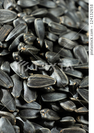 Macro Black Unpeeled Sunflower Seeds 124132658
