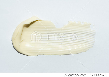 Close-up smear of mayonnaise sauce on white background, top view. Close-up smear of mayonnaise sauce on white background, top view. 124132678