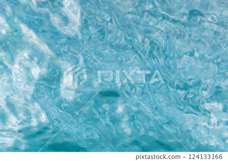 Abstract background with textured and rippled surface of blue water Abstract background with textured and rippled surface of blue water 124133166