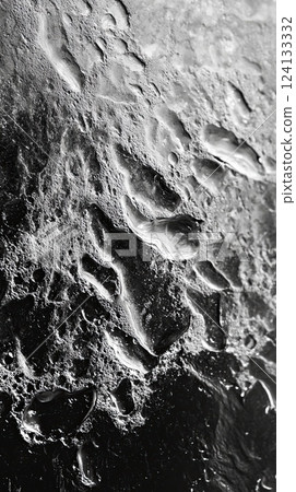 wet and textured black surface with water droplets and streaks, creating a dramatic contrast wet and textured black surface with water droplets and streaks, creating a dramatic contrast 124133332