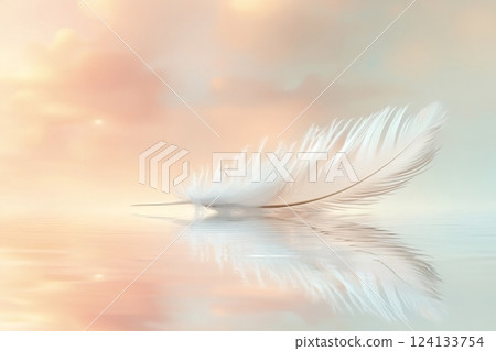 Single white feather floating on water with dreamy pastel sky 124133754