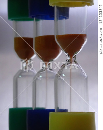 Variety Colors Sandglasses With Falling Sand Soft Focus  124133845