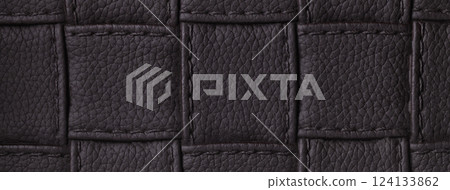 Texture dark brown leather background with square pattern and stitch, macro. Abstract black backdrop from textile 124133862