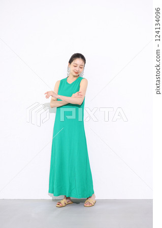 Woman in green dress Woman in green dress 124134096